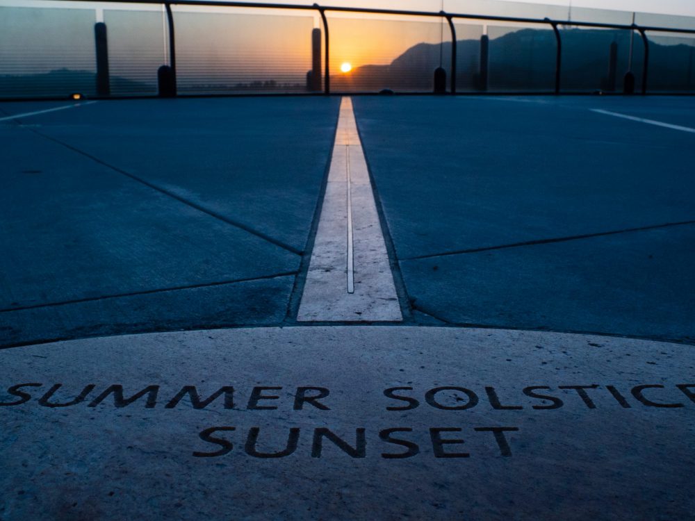 The sunset lining up with the bronze Summer Solstice radial line.